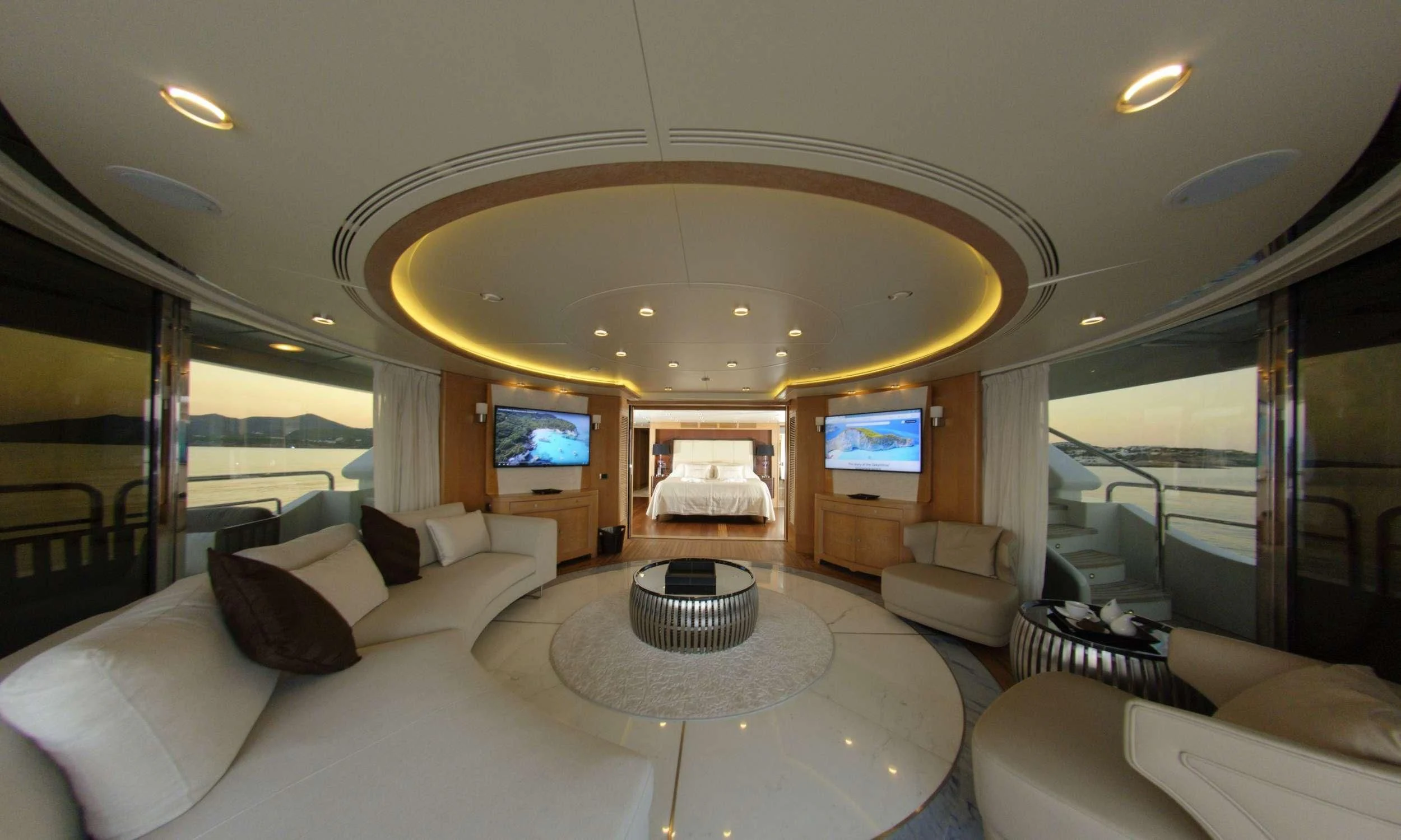 a large living room with a large chandelier aboard GRANDE AMORE Yacht for Charter