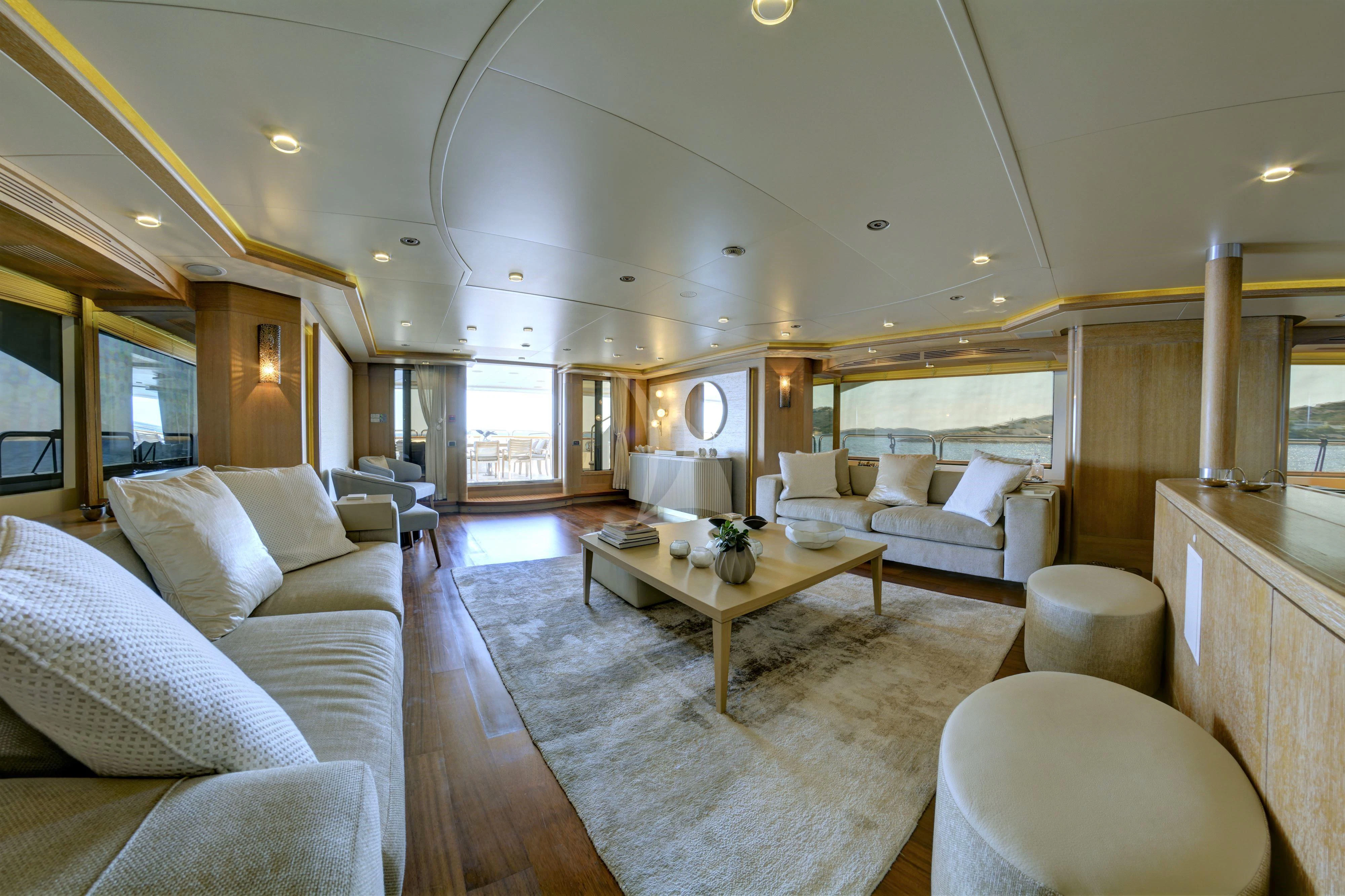 a living room with a large window aboard GRANDE AMORE Yacht for Charter