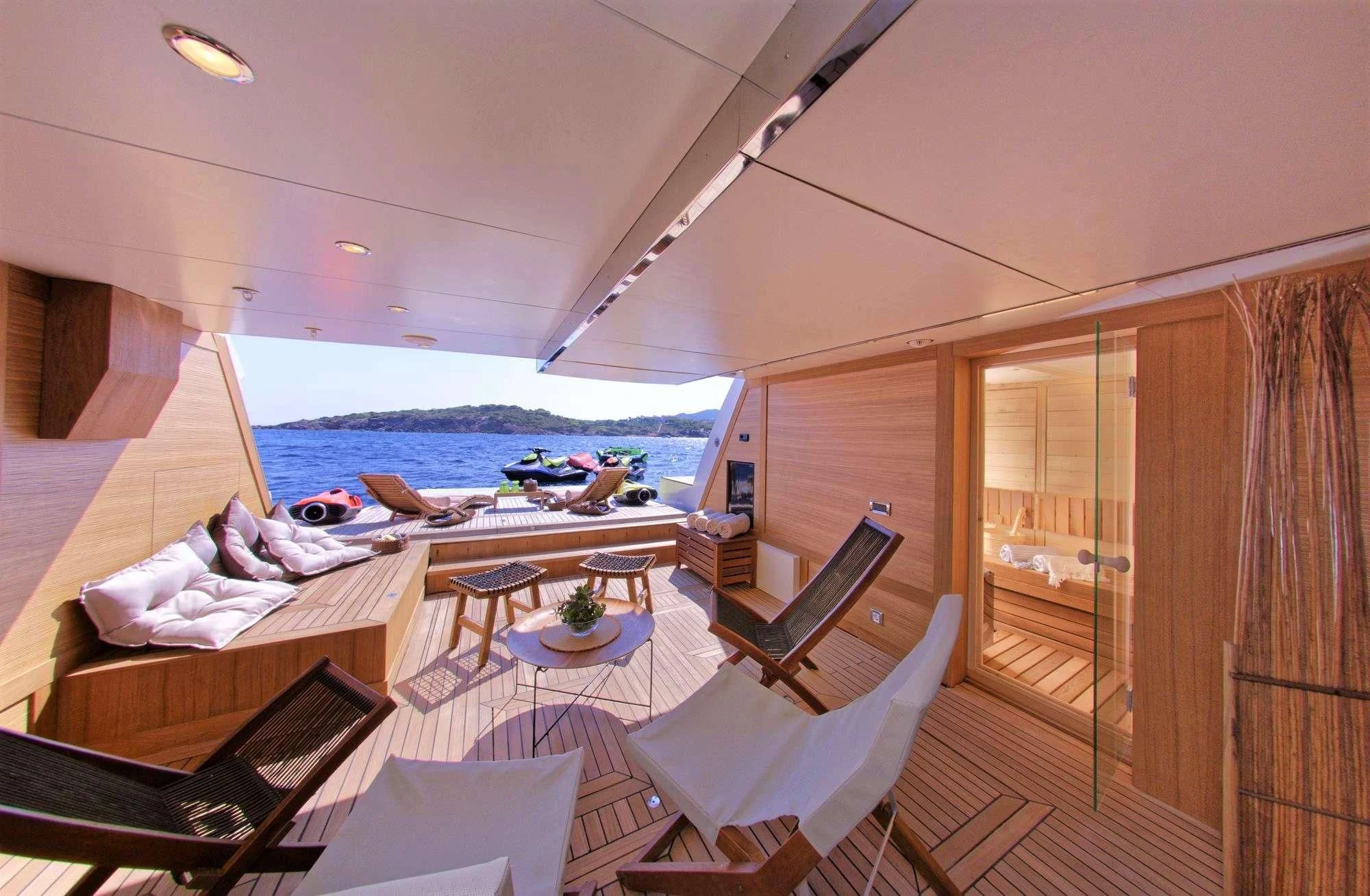 a room with a view of the water and the deck aboard GRANDE AMORE Yacht for Charter