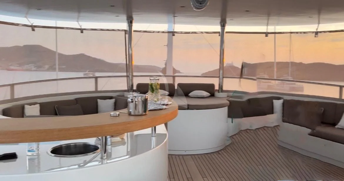 a room with a table and chairs aboard GRANDE AMORE Yacht for Charter