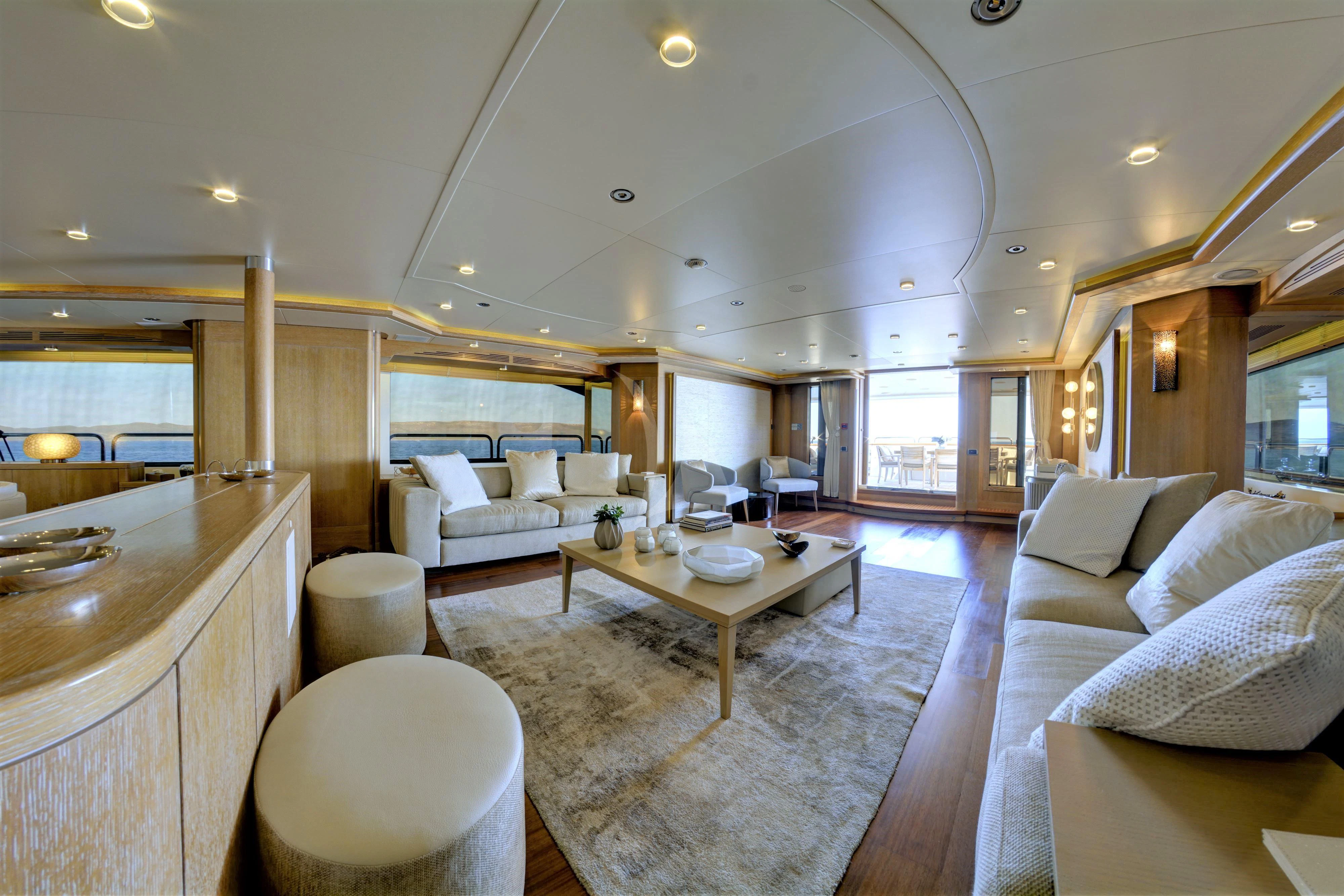 a large living room with a kitchen aboard GRANDE AMORE Yacht for Charter
