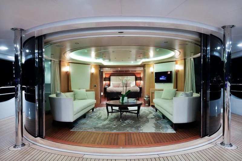 a large living room with a large mirror aboard GRANDE AMORE Yacht for Charter