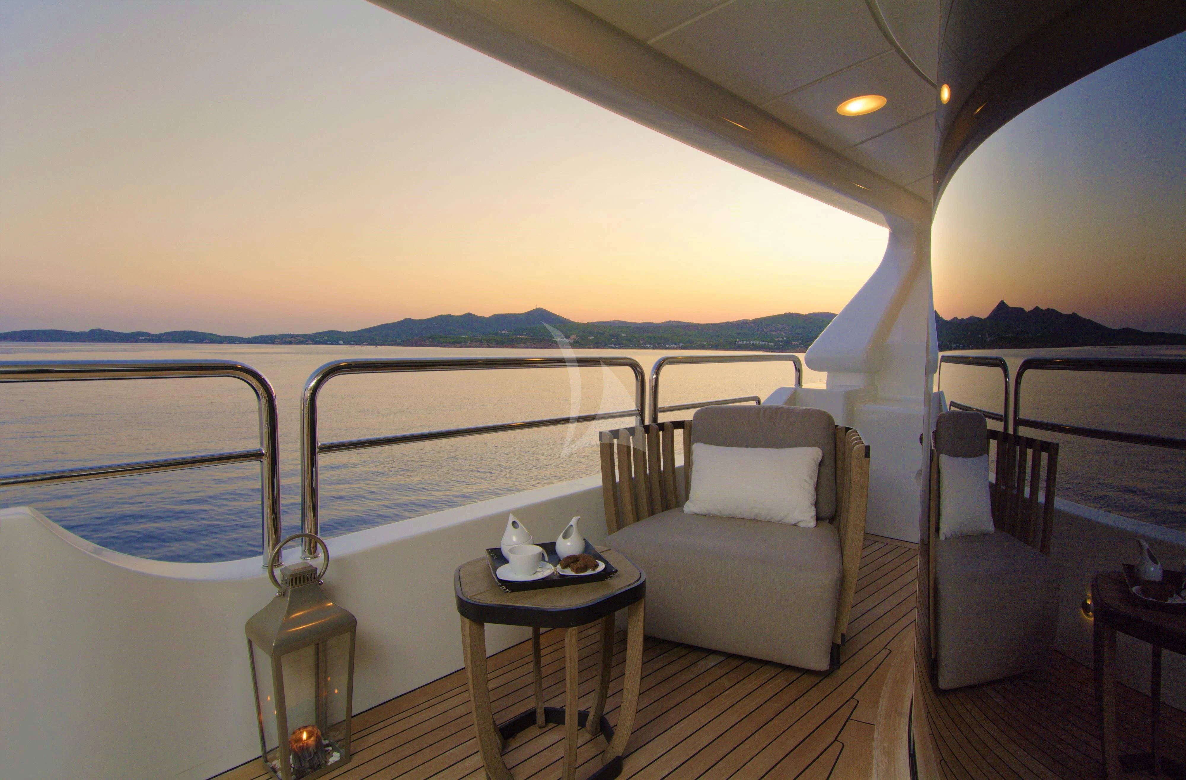 a room with a bed and a table on a boat aboard GRANDE AMORE Yacht for Charter