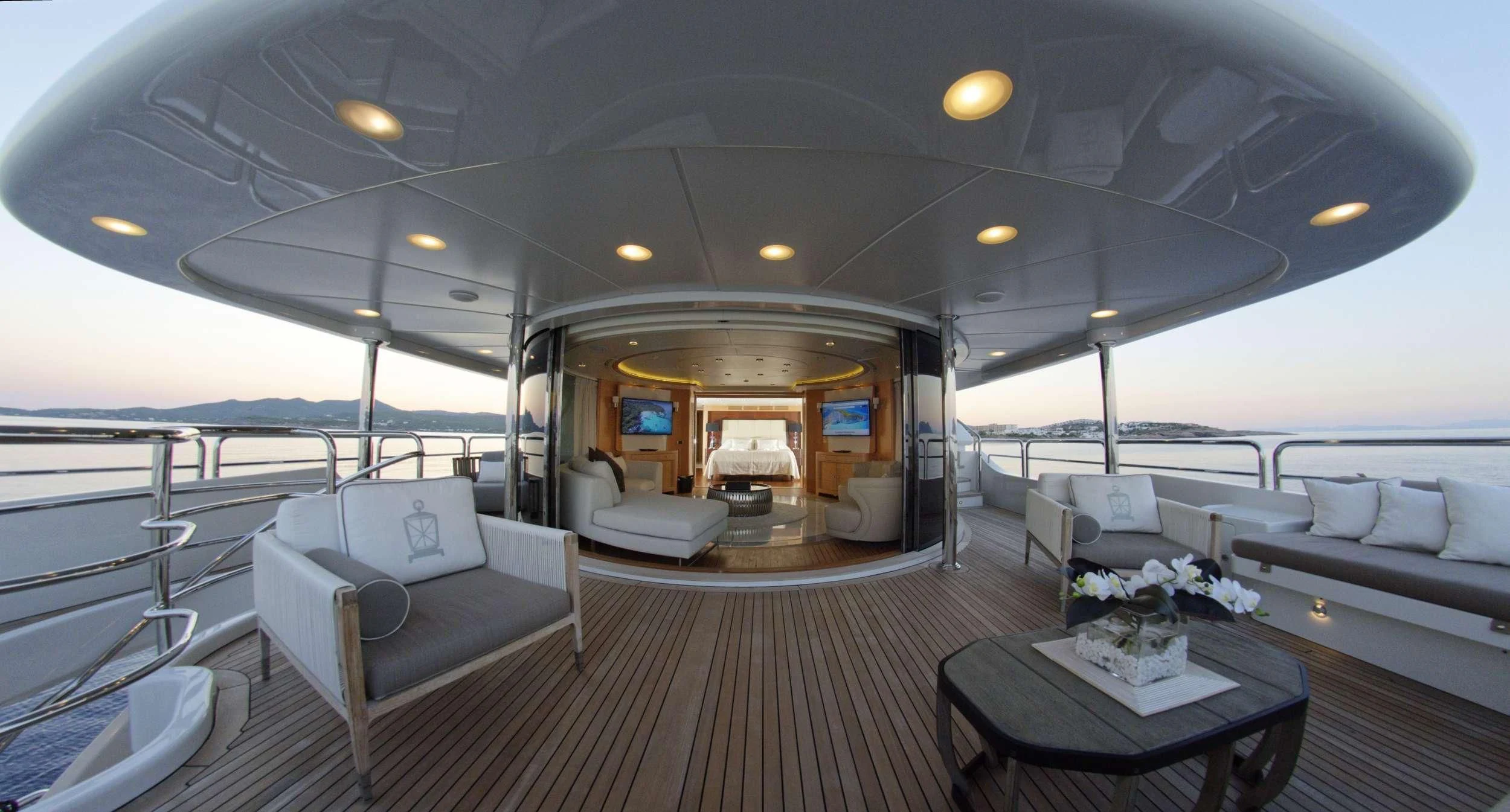 a large living room with a large deck and a large pool aboard GRANDE AMORE Yacht for Charter