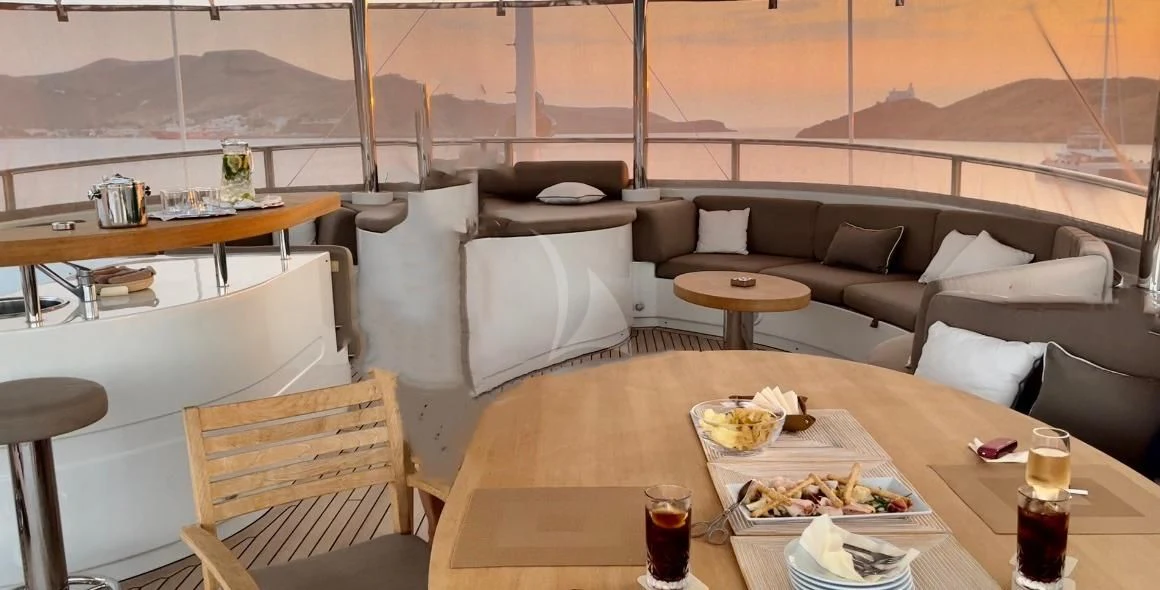 a room with couches and chairs aboard GRANDE AMORE Yacht for Charter