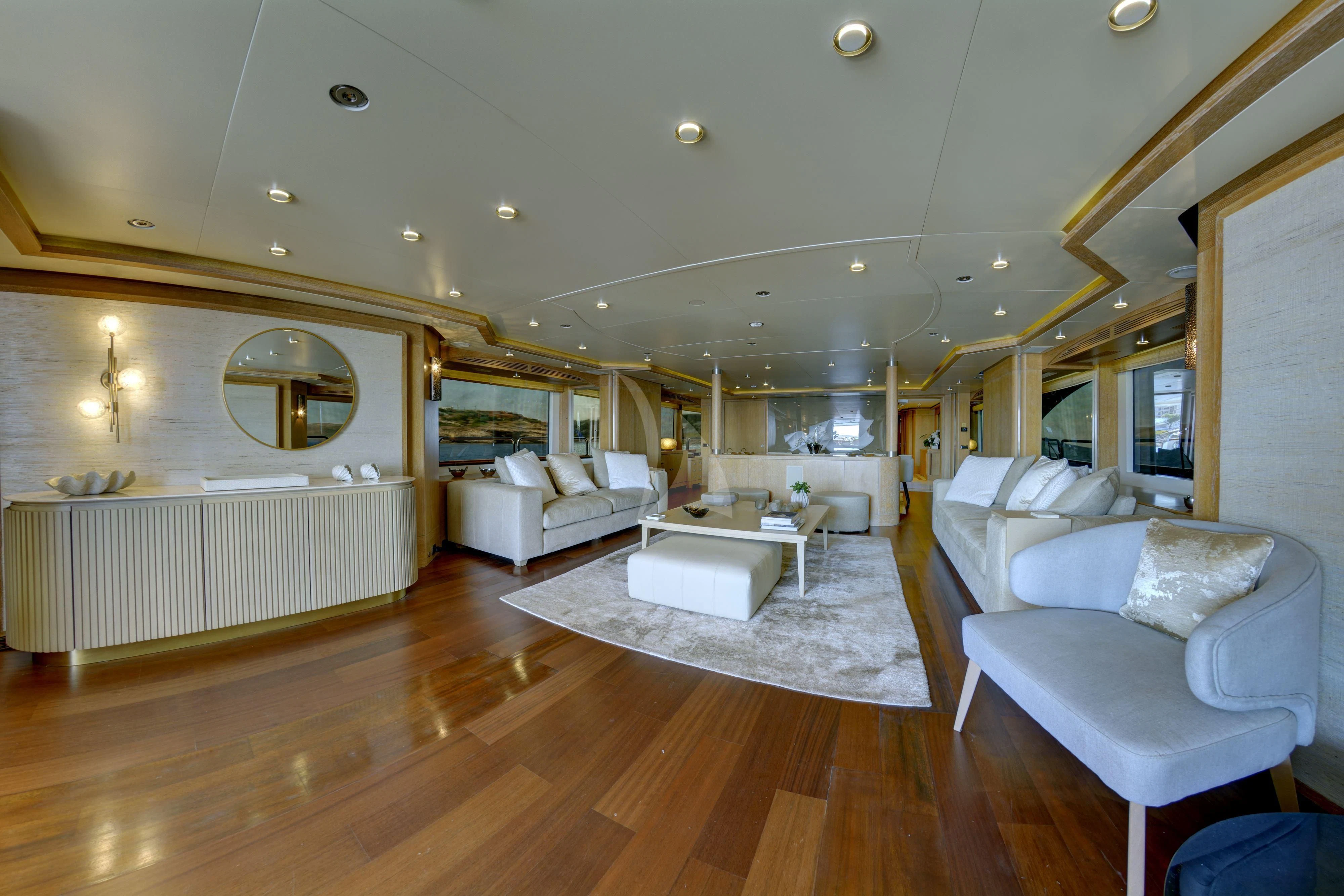a living room with a large mirror aboard GRANDE AMORE Yacht for Charter