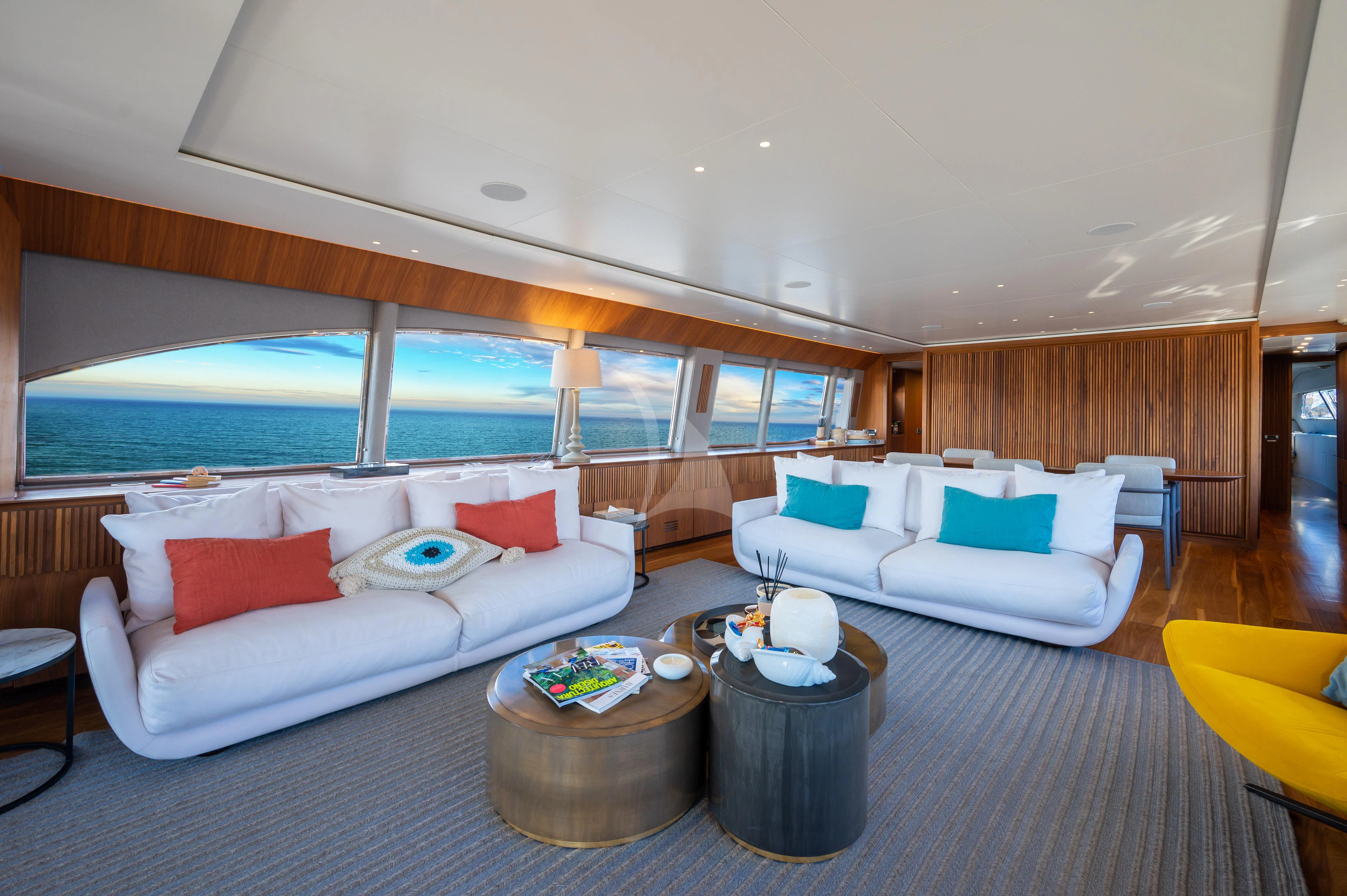 a living room with a large window aboard WHISPER V Yacht for Sale