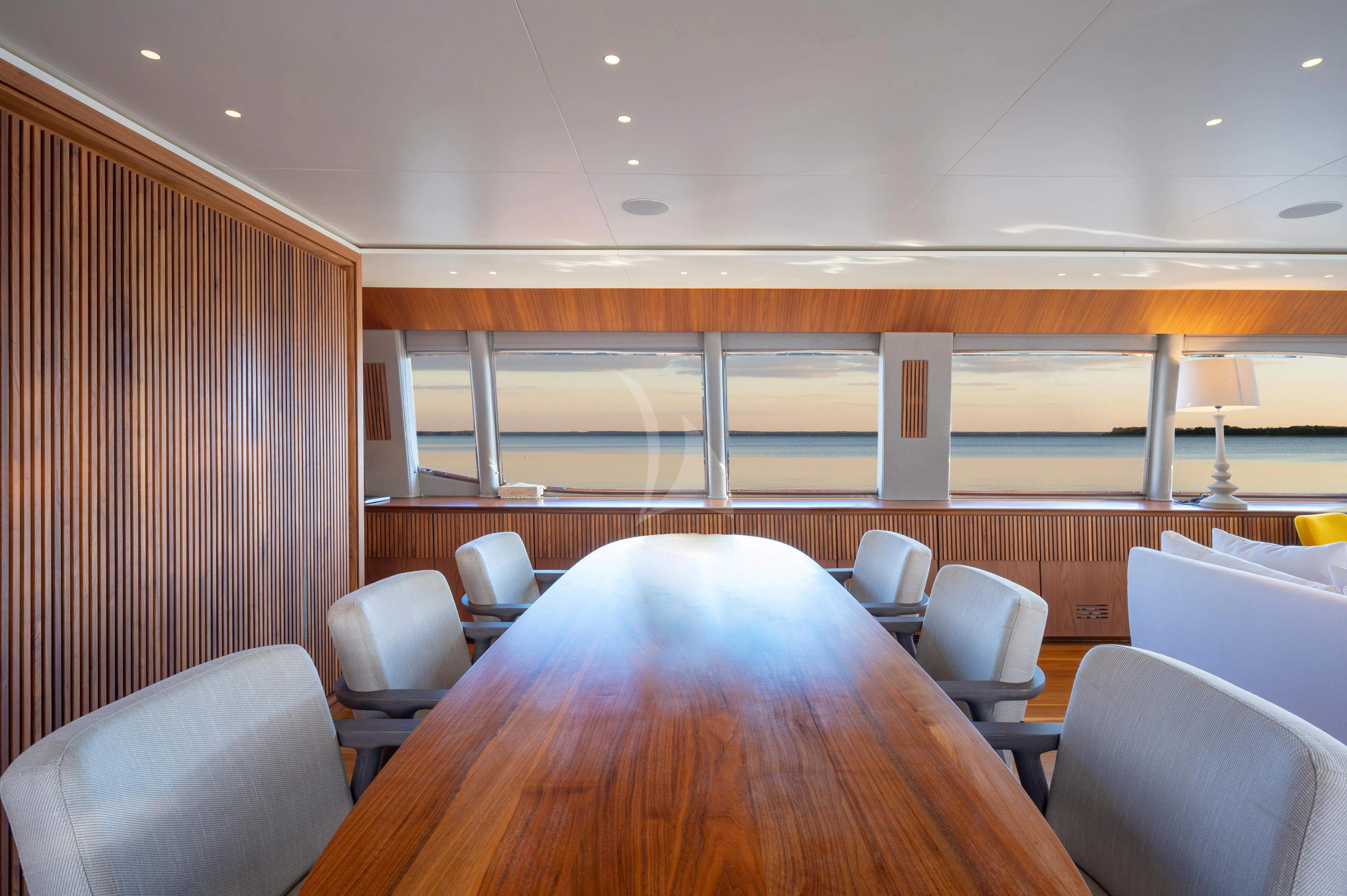 a conference room with a table and chairs aboard WHISPER V Yacht for Sale