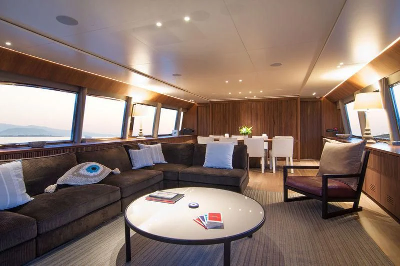 a living room with a couch and a table aboard WHISPER V Yacht for Sale