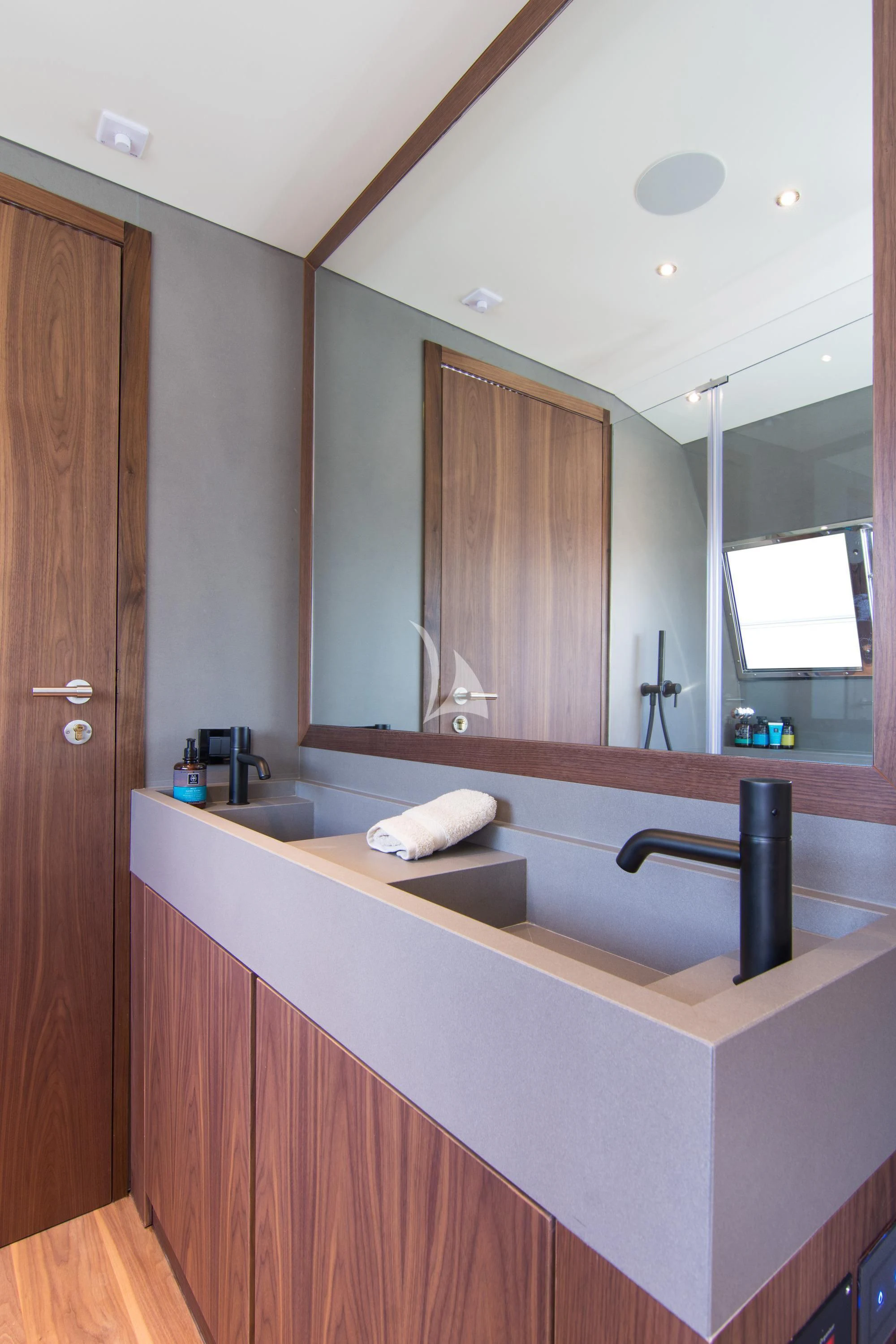 a bathroom with a large mirror aboard WHISPER V Yacht for Sale