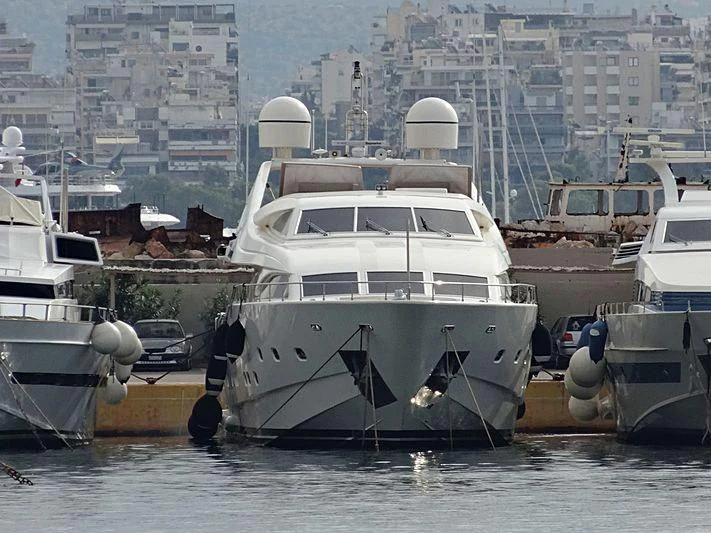 a group of boats are parked in a harbor aboard WHISPER V Yacht for Sale