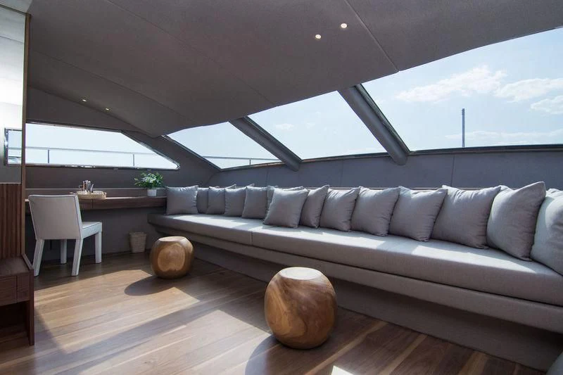 a living room with a couch and a table aboard WHISPER V Yacht for Sale