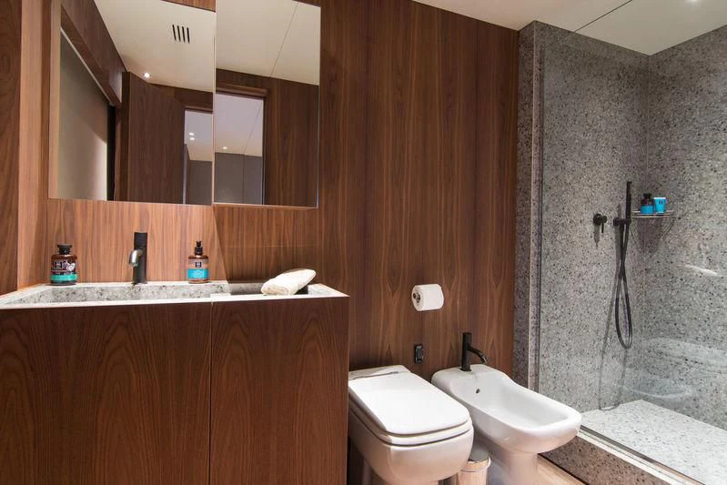 a bathroom with a sink and toilet aboard WHISPER V Yacht for Sale