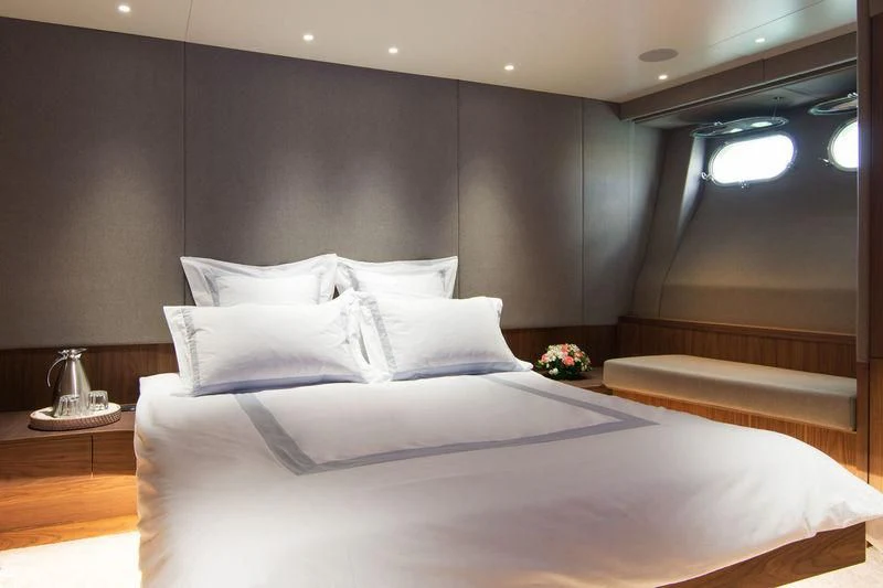 a bed with white sheets aboard WHISPER V Yacht for Sale