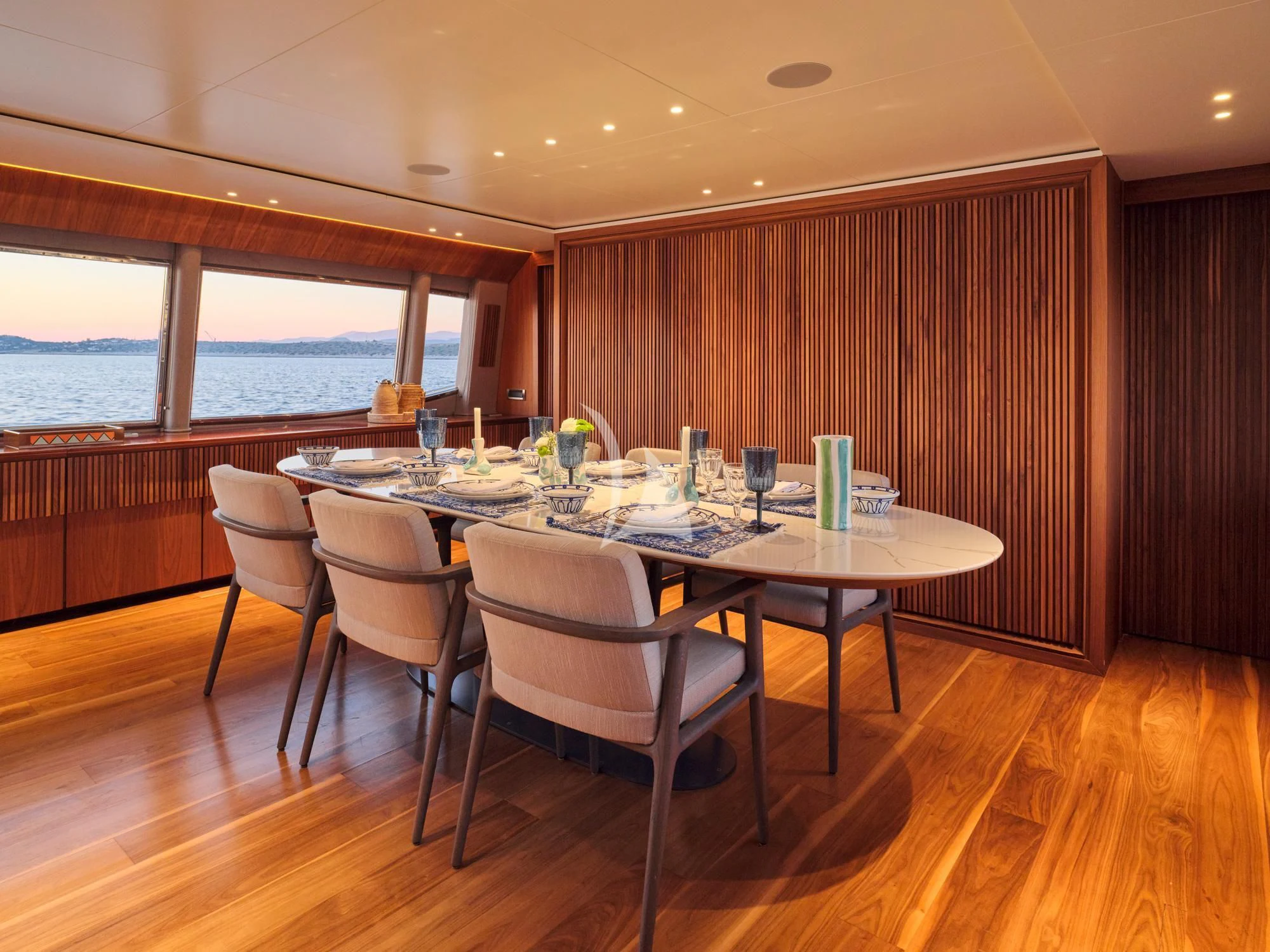 a dining table with chairs aboard WHISPER V Yacht for Sale
