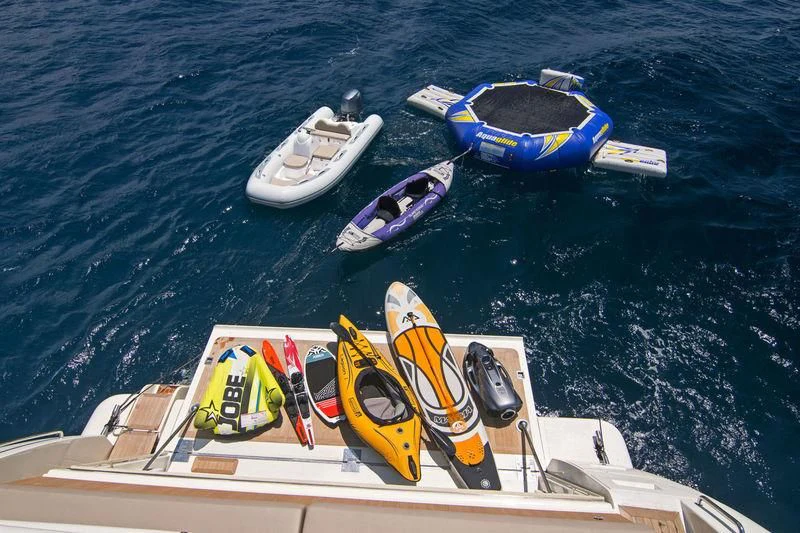 a boat with kayaks on it aboard WHISPER V Yacht for Sale