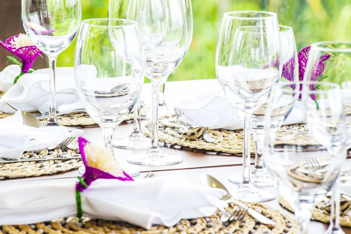 a table with wine glasses and napkins on it aboard ARIA AMAZON Yacht for Sale