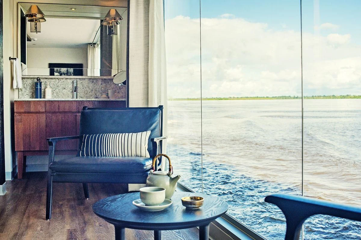a room with a table and chairs aboard ARIA AMAZON Yacht for Sale