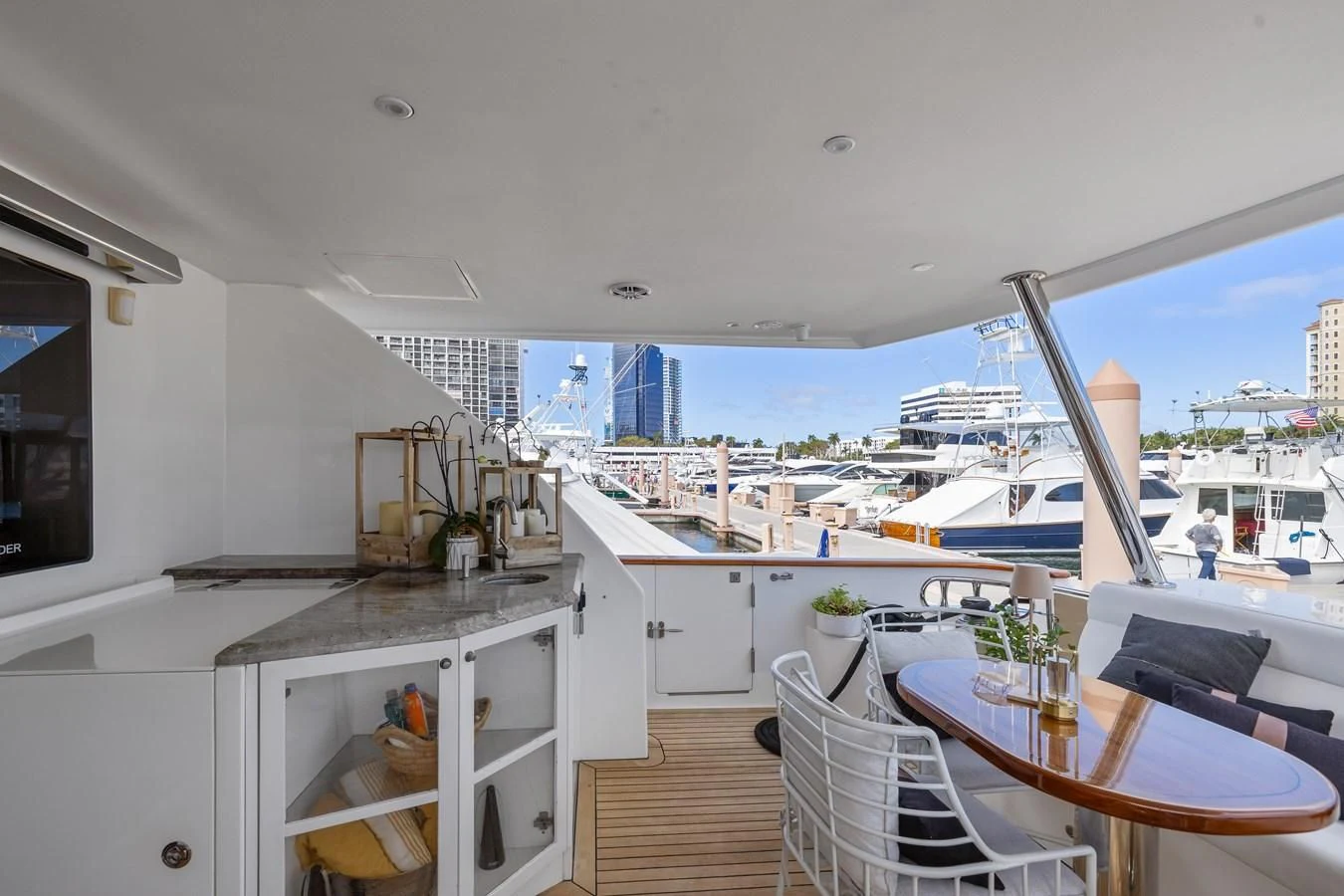 a kitchen with a table and chairs aboard RELENTLESS Yacht for Sale