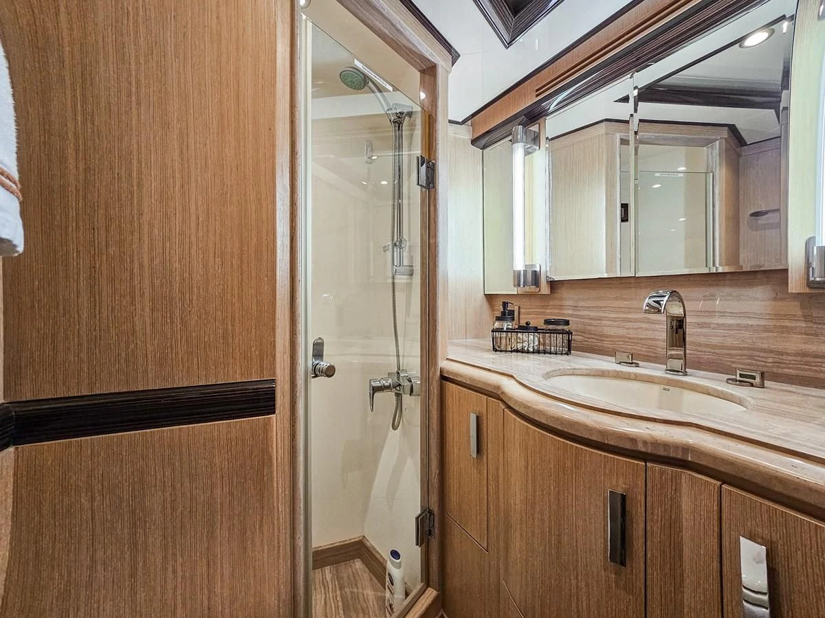 a bathroom with a shower and sink aboard RELENTLESS Yacht for Sale