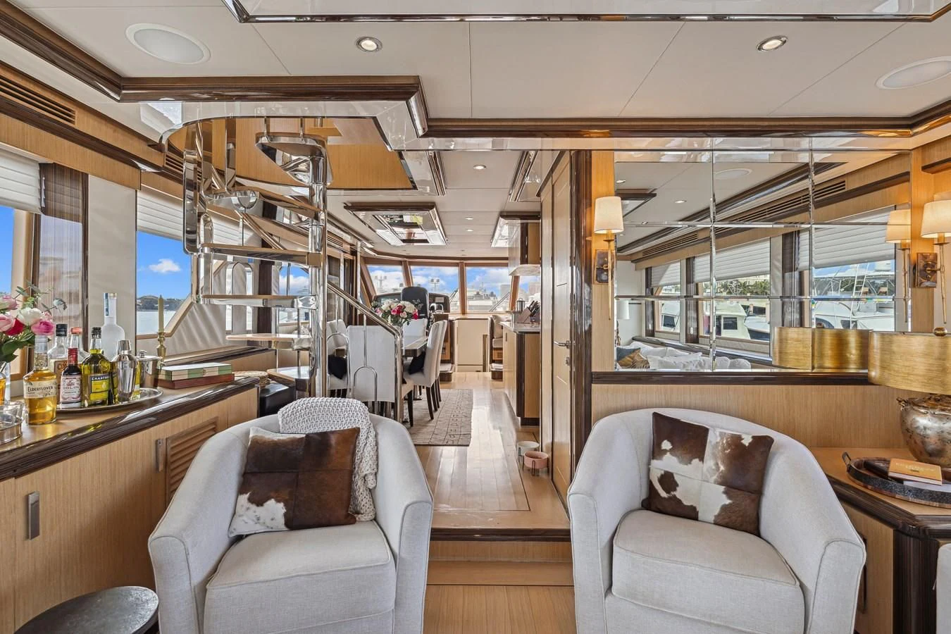 a room with a bar and chairs aboard RELENTLESS Yacht for Sale
