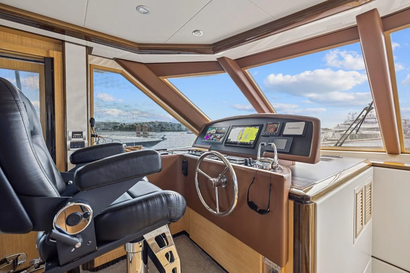 inside of a vehicle with a radio and steering wheel aboard RELENTLESS Yacht for Sale