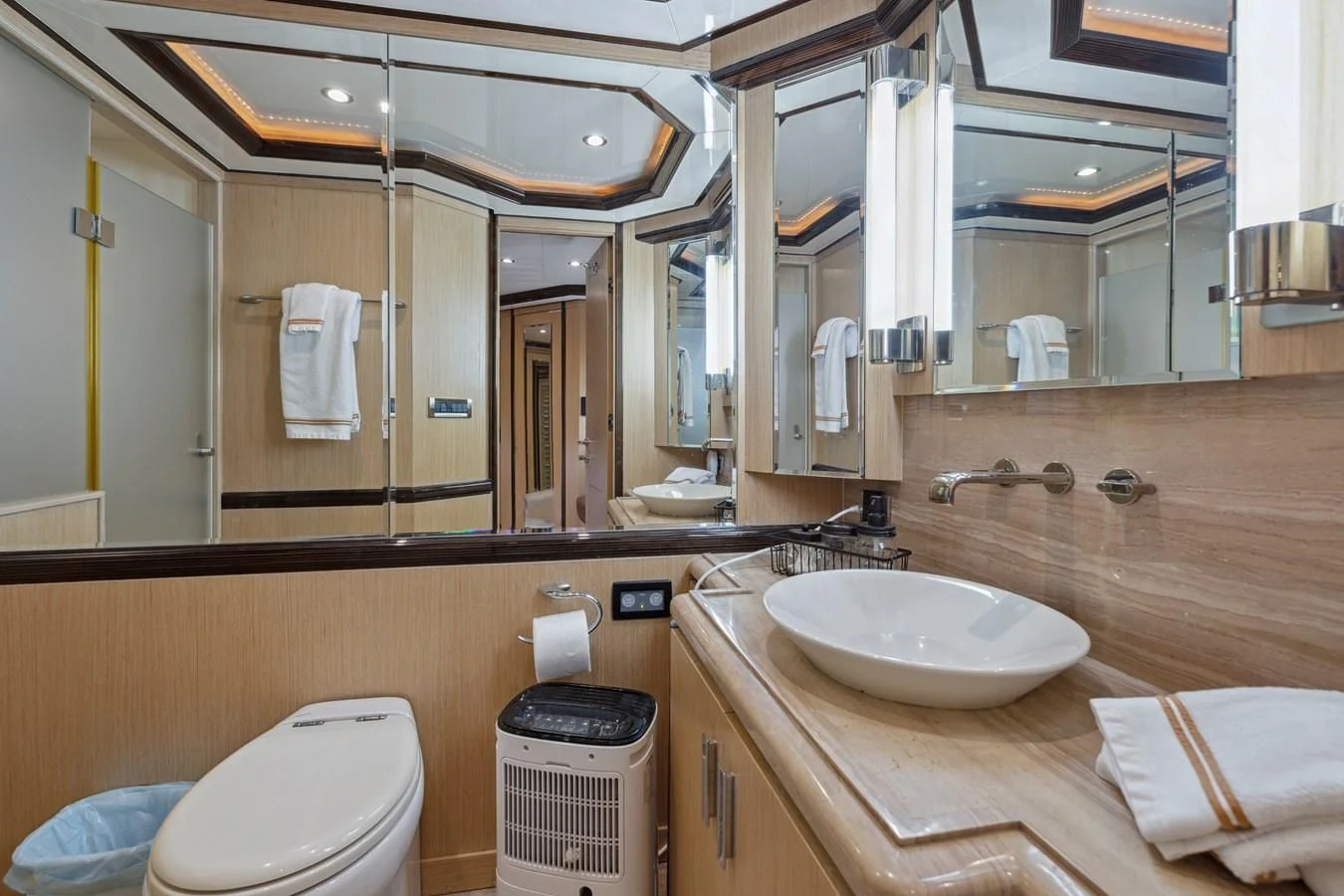 a bathroom with a sink and a mirror aboard RELENTLESS Yacht for Sale