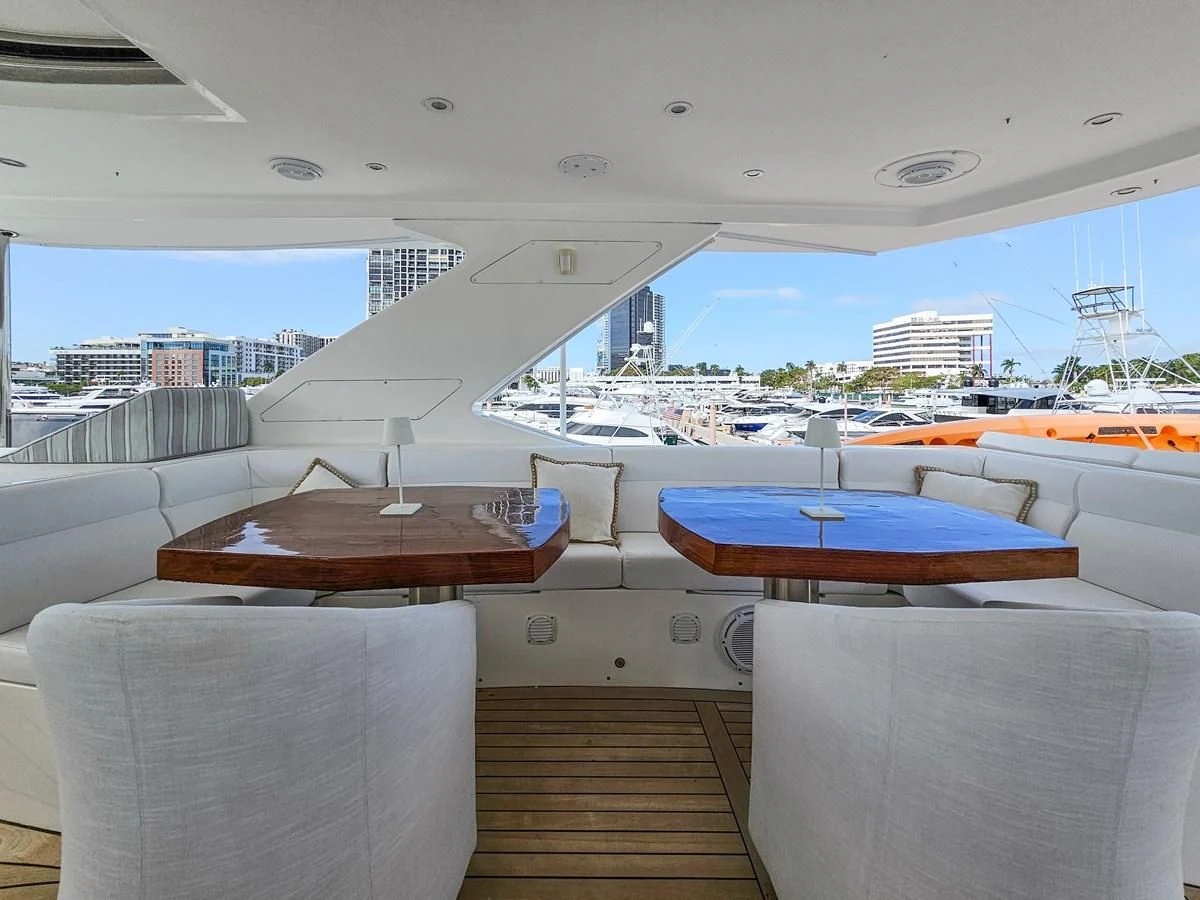 a room with a view of the water and a city aboard RELENTLESS Yacht for Sale