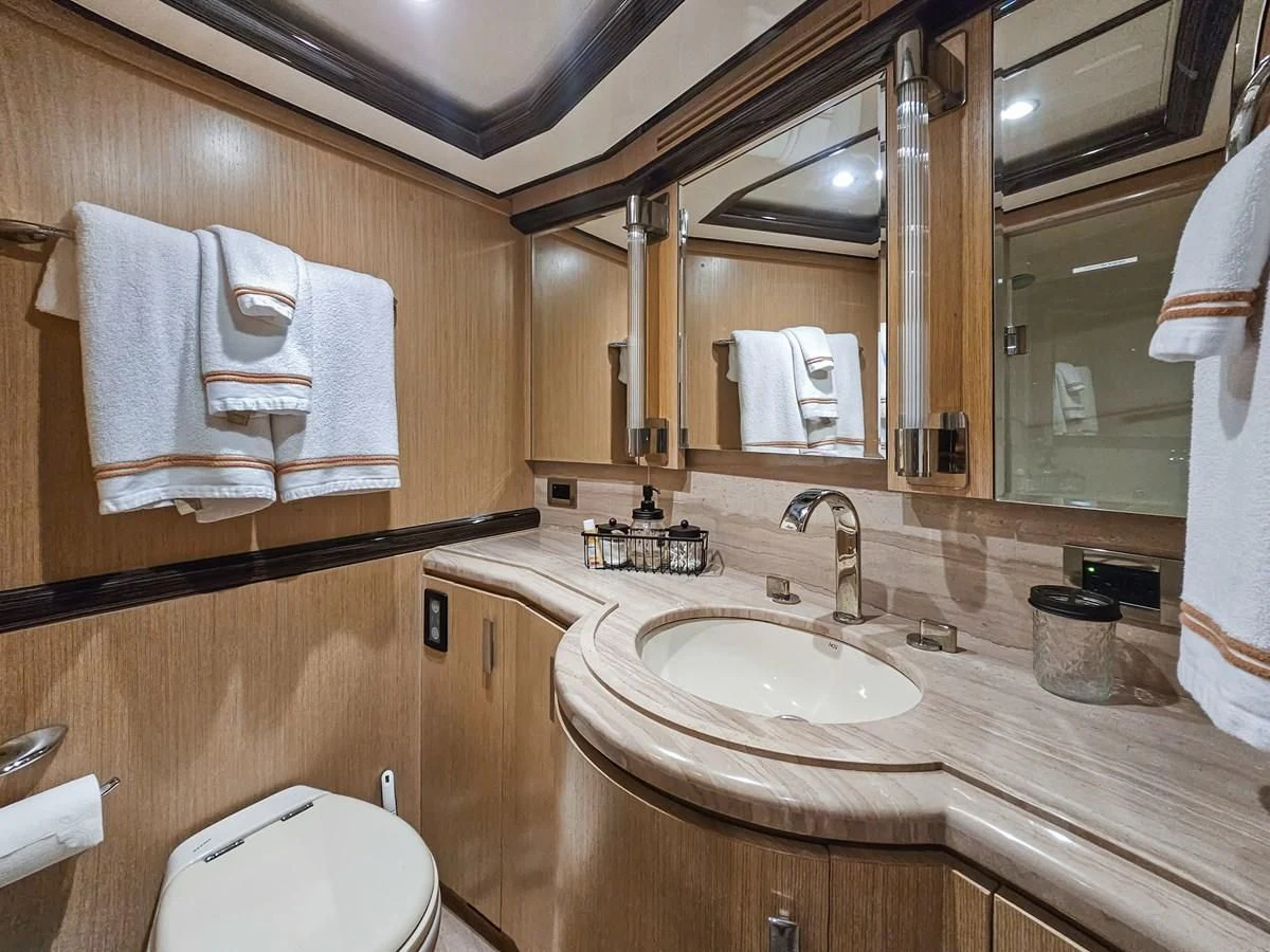 a bathroom with a large mirror aboard RELENTLESS Yacht for Sale