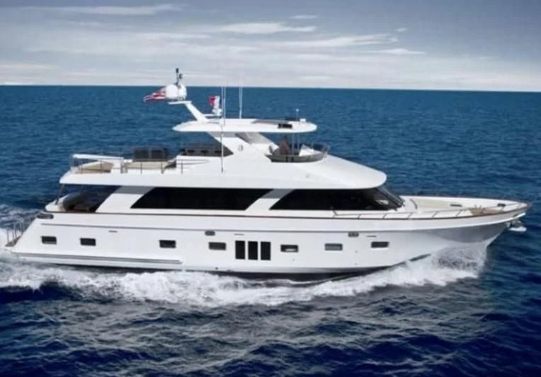 a white yacht on the water aboard RELENTLESS Yacht for Sale
