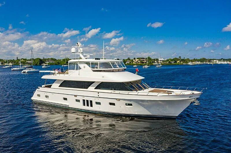 a white boat on the water aboard RELENTLESS Yacht for Sale