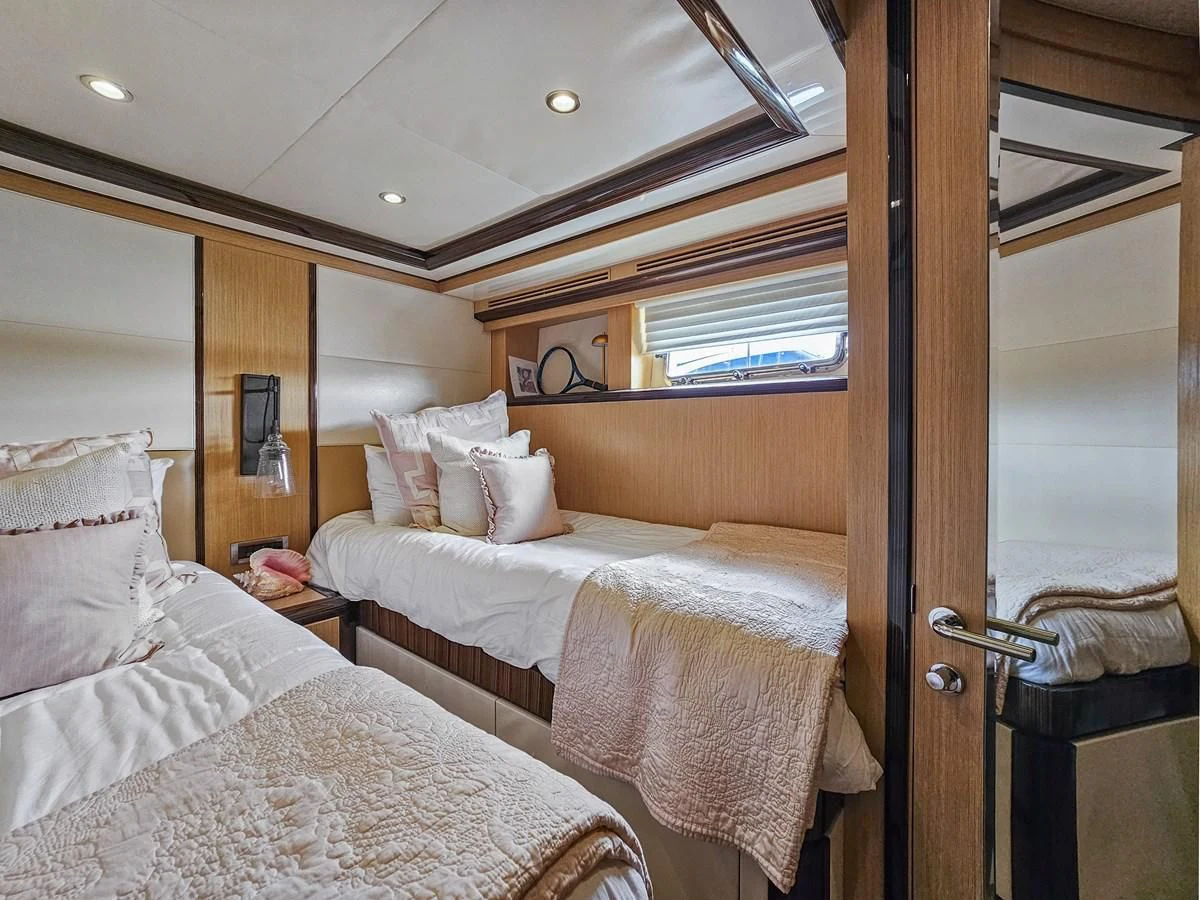 a couple of beds in a hotel room aboard RELENTLESS Yacht for Sale
