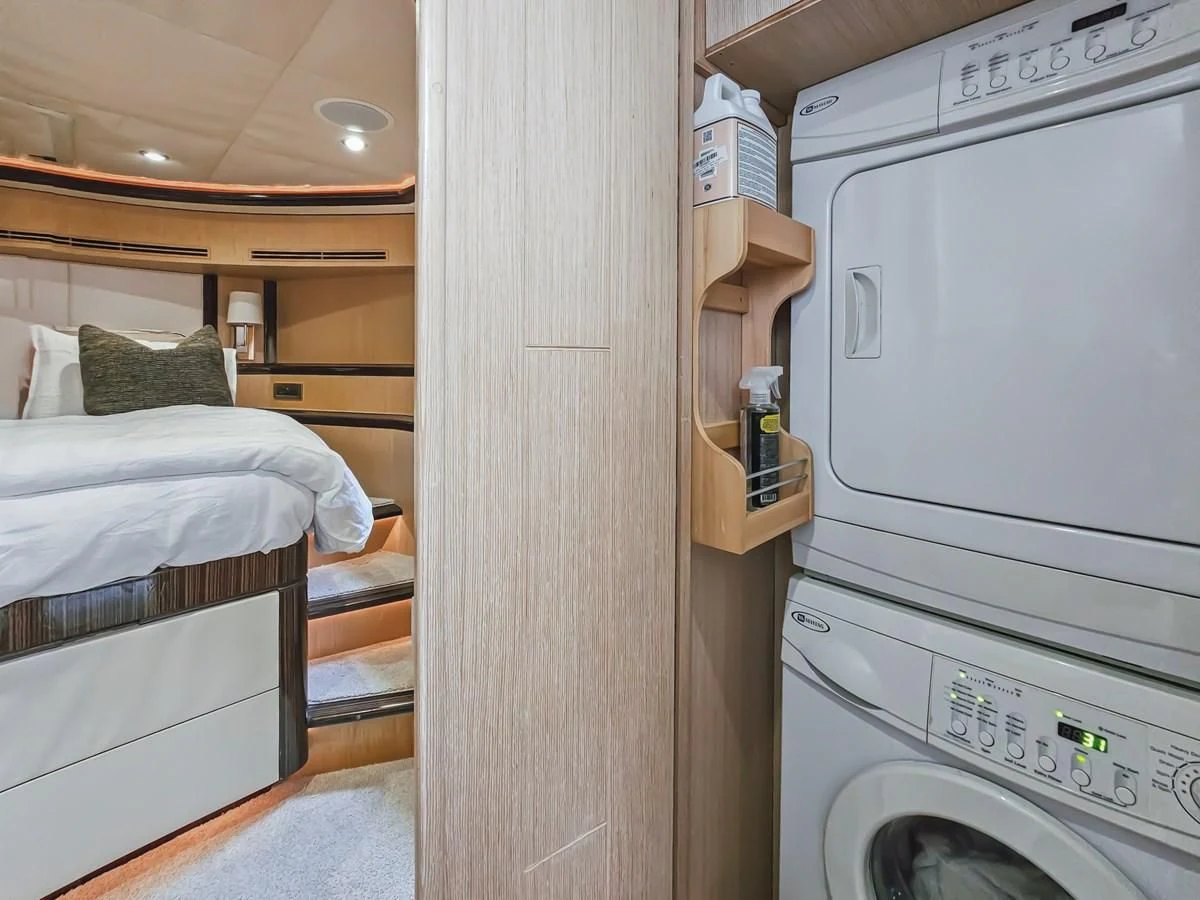 a small bedroom with a small bed aboard RELENTLESS Yacht for Sale