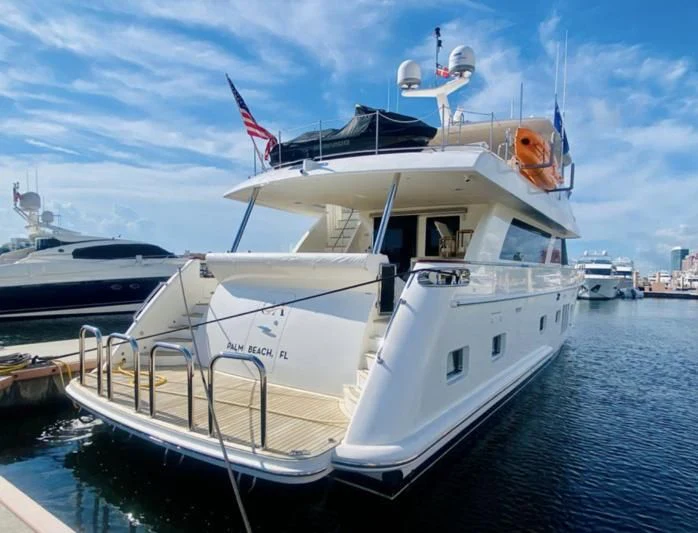 a boat docked at a pier aboard RELENTLESS Yacht for Sale