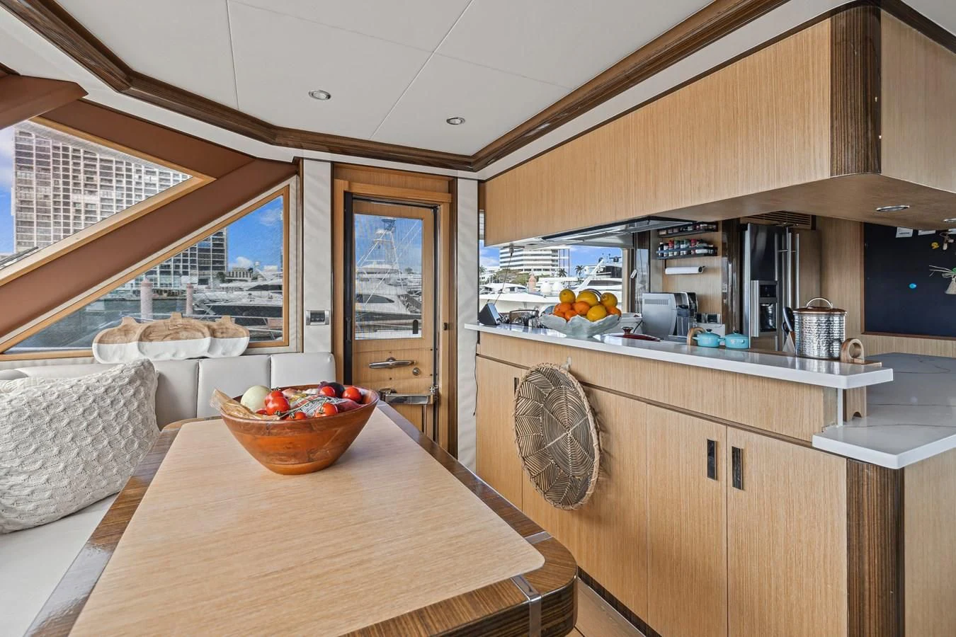 a kitchen with a basket and a basket on a table aboard RELENTLESS Yacht for Sale