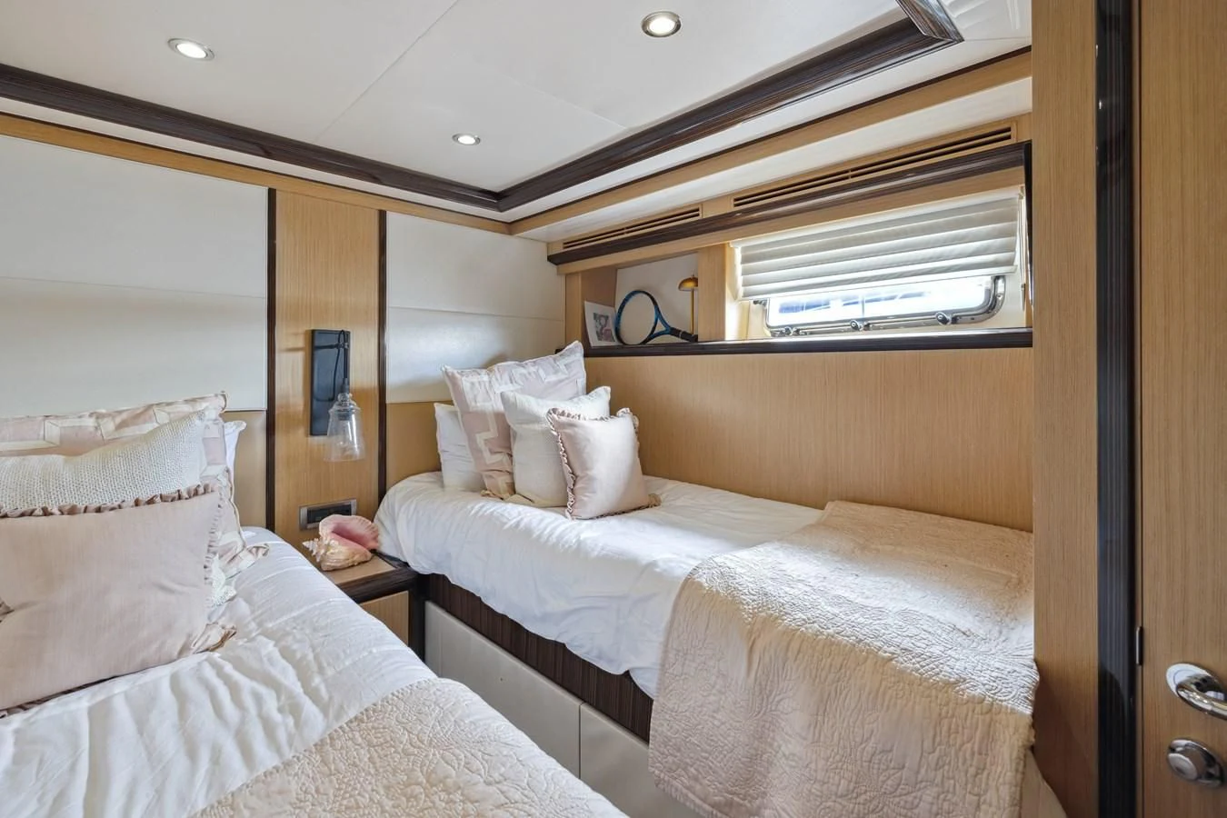 a room with two beds aboard RELENTLESS Yacht for Sale