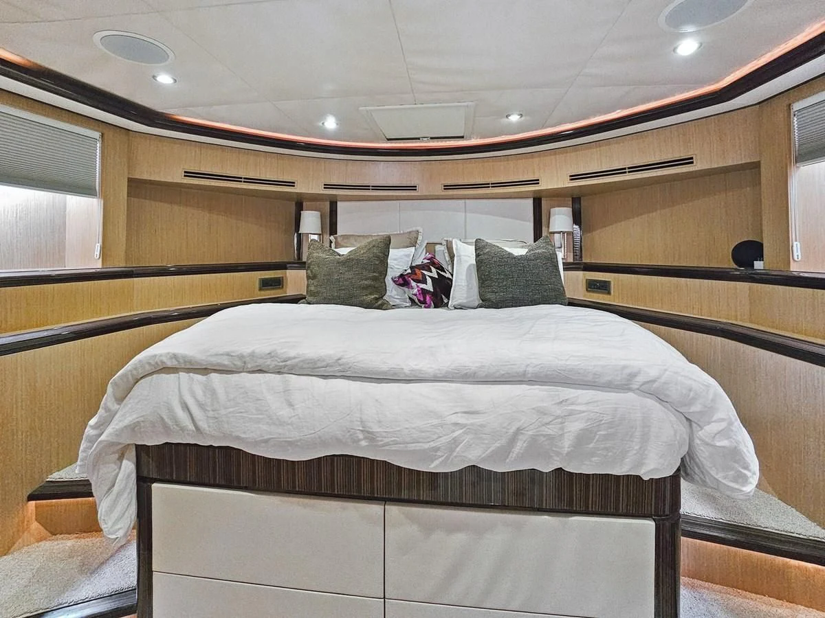 a bed with pillows aboard RELENTLESS Yacht for Sale