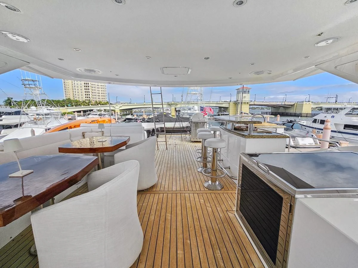 a room with a deck and a view of the water aboard RELENTLESS Yacht for Sale