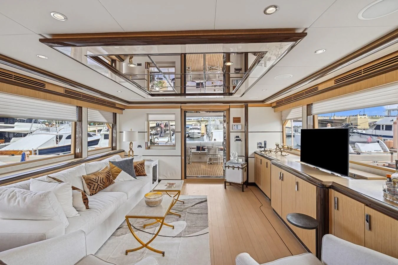 a living room with a large window aboard RELENTLESS Yacht for Sale