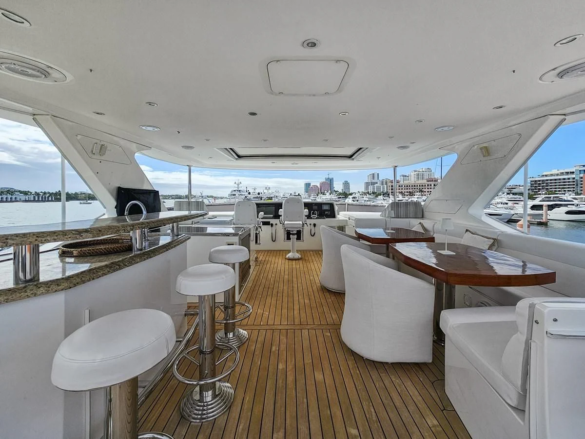 a boat with tables and chairs aboard RELENTLESS Yacht for Sale