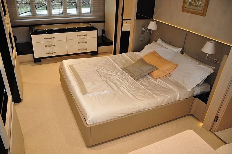 a bed in a room aboard MIRAGE Yacht for Sale