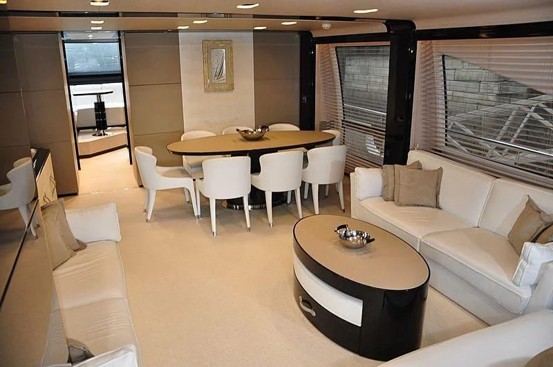 a room with a table and chairs aboard MIRAGE Yacht for Sale
