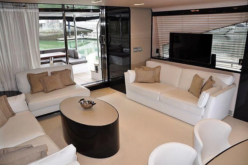 a living room with a couch and a tv aboard MIRAGE Yacht for Sale