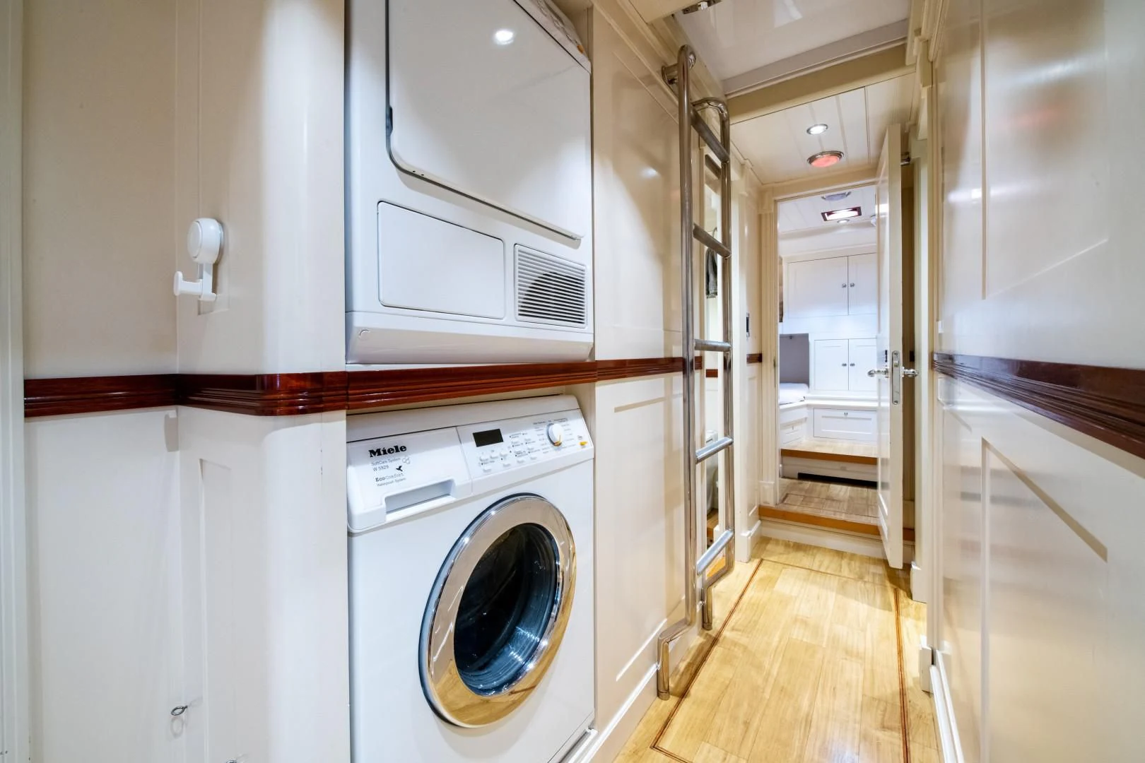 a laundry room with a washing machine aboard RAINBOW Yacht for Sale