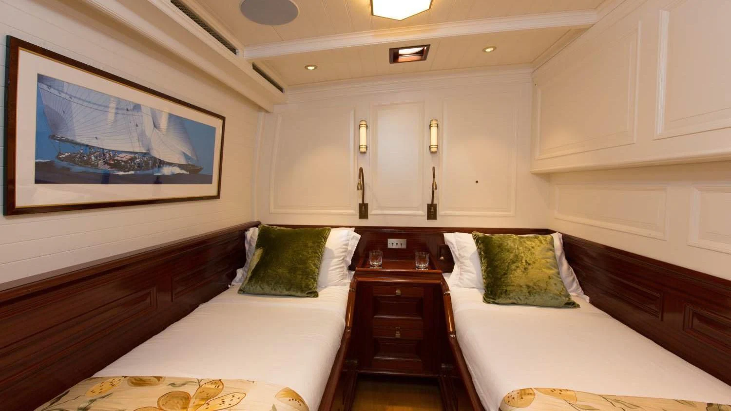 a room with two beds aboard RAINBOW Yacht for Sale