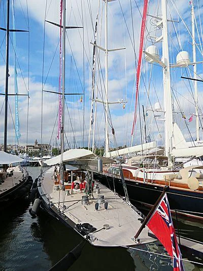 a group of boats are parked in a harbor aboard RAINBOW Yacht for Sale