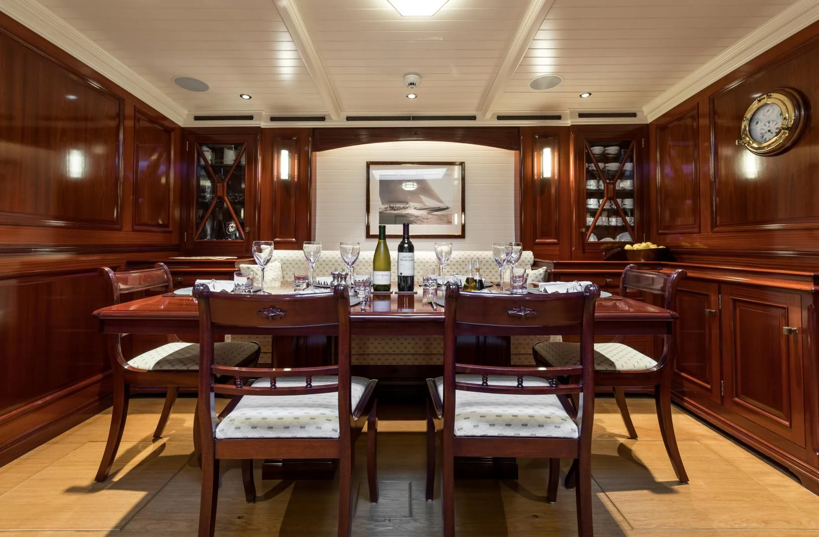 a wine tasting room with a table and chairs aboard RAINBOW Yacht for Sale