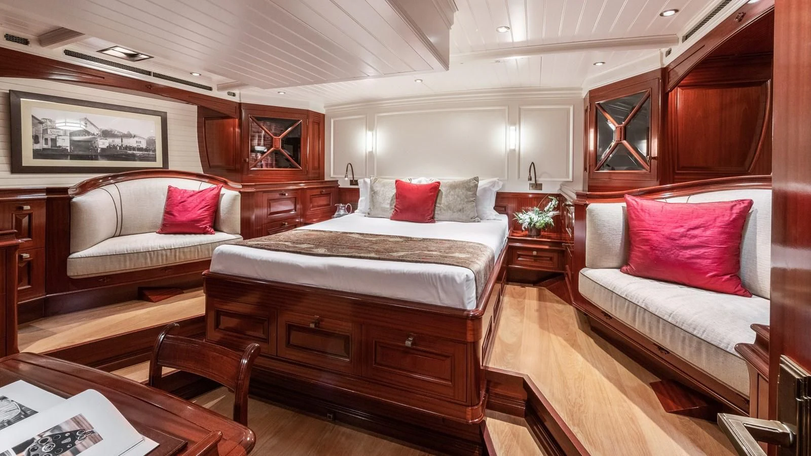 a room with a couple beds aboard RAINBOW Yacht for Sale