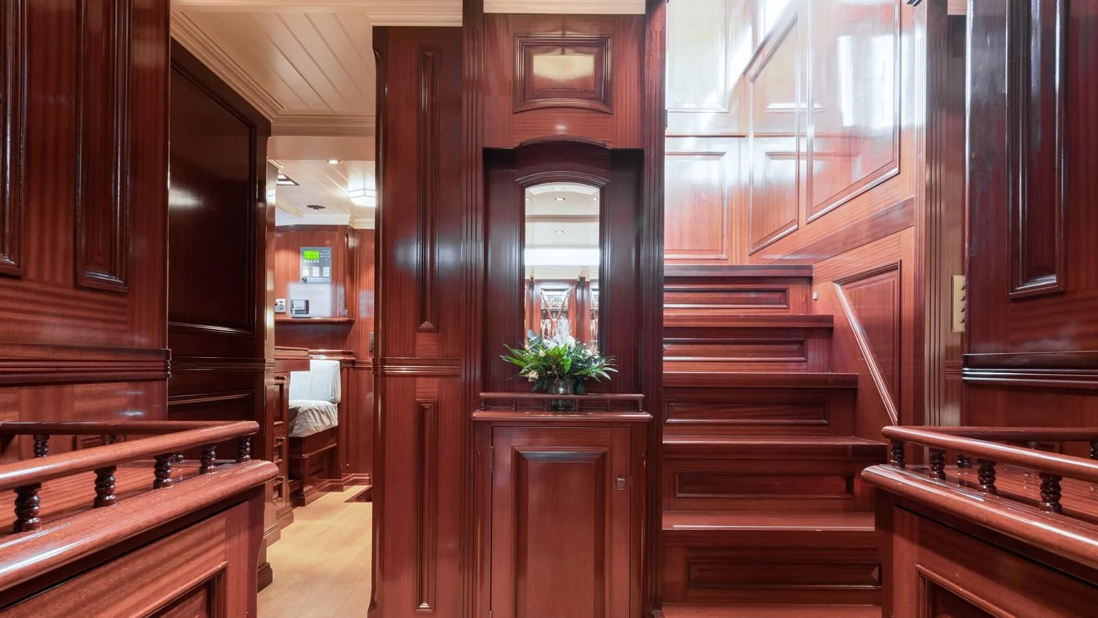 a wood cabinet in a room aboard RAINBOW Yacht for Sale