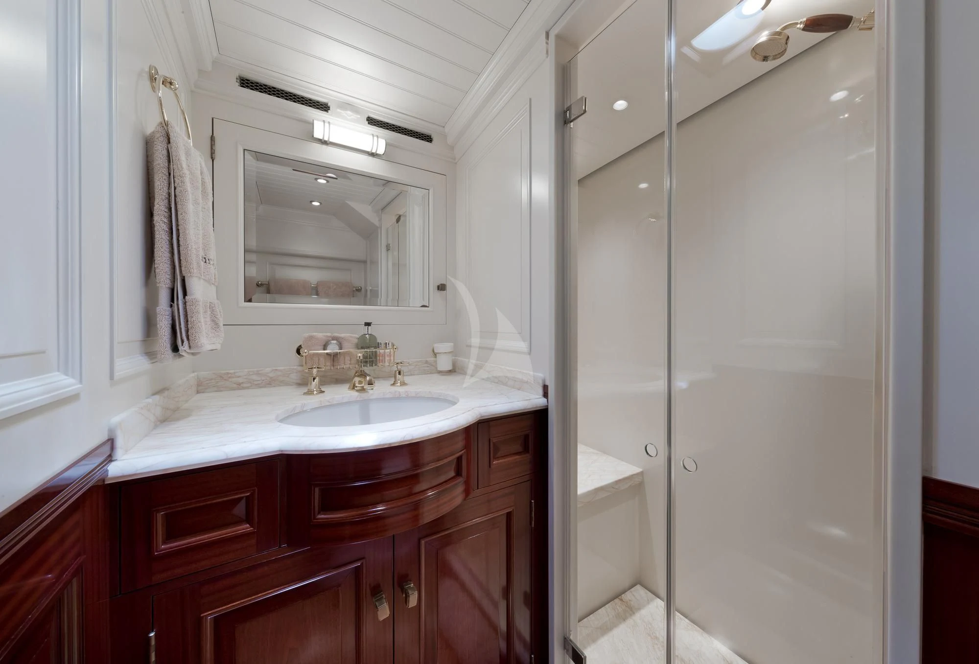 a bathroom with a glass shower aboard RAINBOW Yacht for Sale